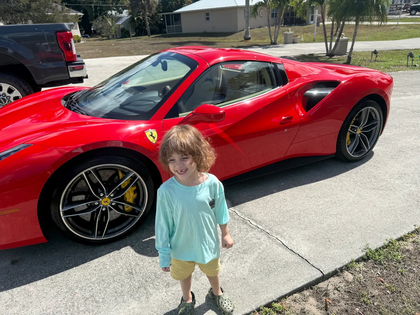 The next generation of Duncan Elite Detailing beside a freshly detailed Ferrari